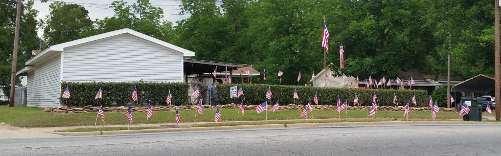 Home with American Flags Displayed for Memorial Day