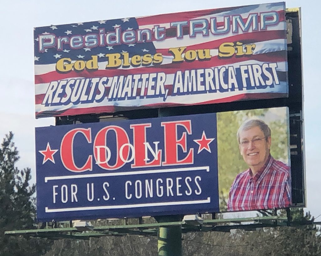 Billboards of Donald Trump and Don Cole