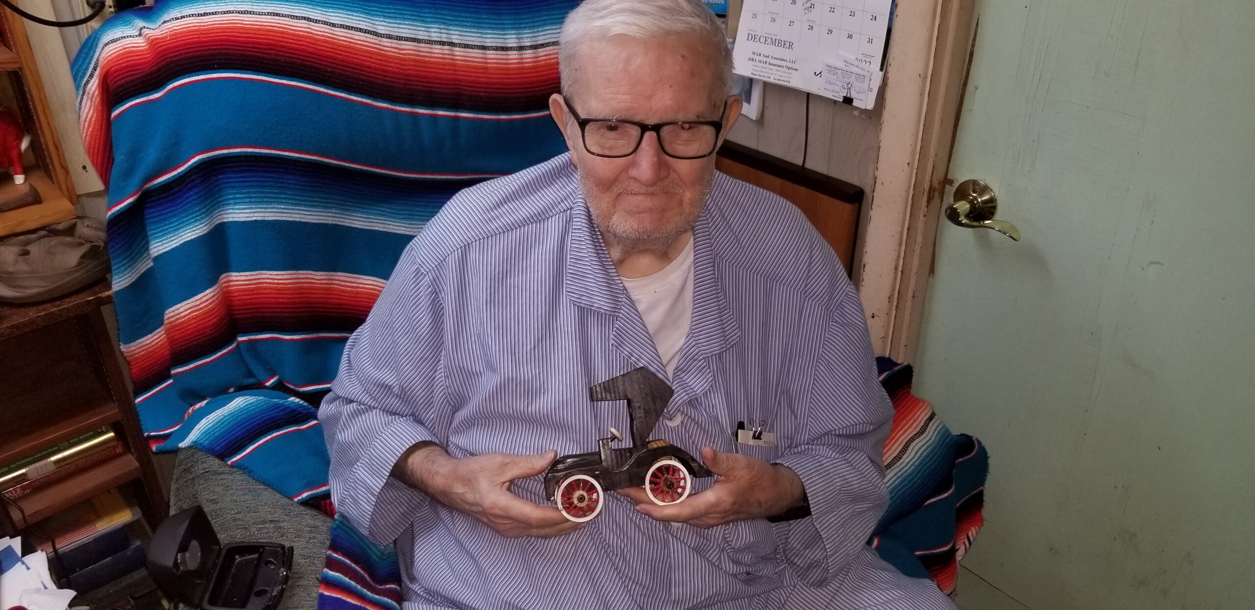 Man holding toy Ford Model T